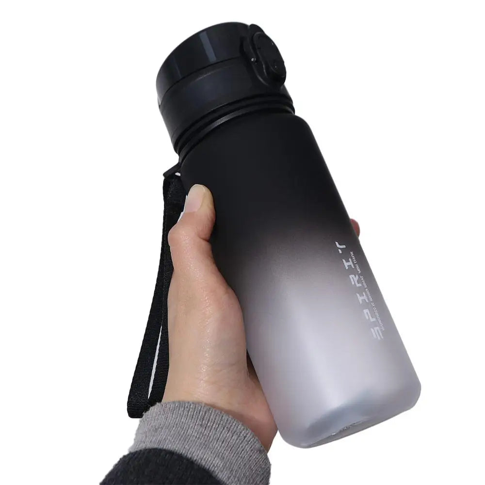 Botella deportiva de 1 litro, color degradado, portátil y a prueba de fugas.