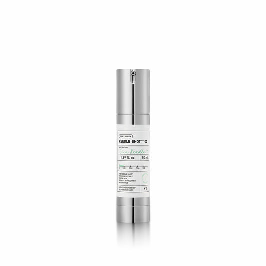 Skincare serum bottle with silver cap and white label on a white background