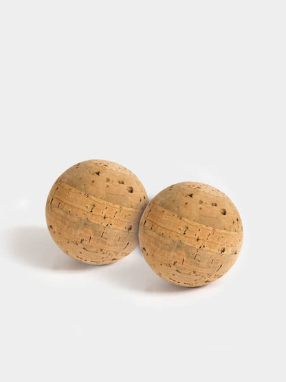Two cork balls on a white background