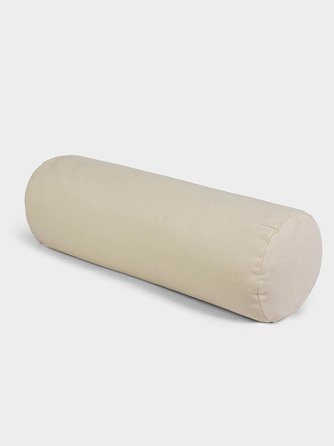 Beige cylindrical pillow on a white background