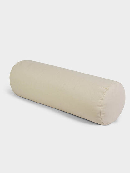 Beige cylindrical pillow on a white background
