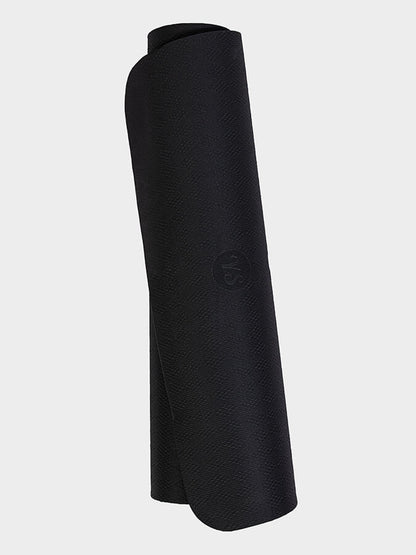 Rolled-up black yoga mat on a light gray background