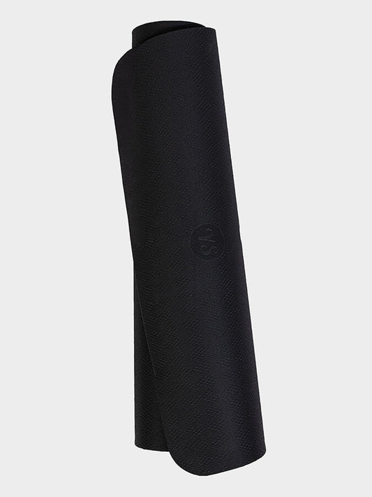 Rolled-up black yoga mat on a light gray background